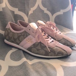 Peach/tan logo Coach dress sneakers.